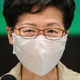 Hong Kong’s Chief Executive Carrie Lam speaks at the government headquarters in Hong Kong while wearing a reusable “CU mask” on May 5, 2020.